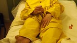 Filling up a condom in a yellow raincoat snapshot 2