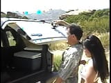Watch the slutty asian girl sucking his cock in the back of the truck snapshot 4