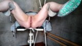 Gyno speculum in her pussy on gyno chair snapshot 4