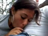 latin girl giving a blowjob in the park snapshot 4