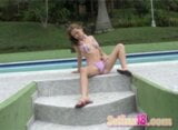 Poolside solo teen babe fingers her pussy snapshot 1