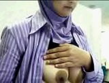 Indonesian house wife yoli with hijab playing boobs snapshot 1