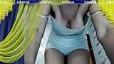 Cheerful housewife Lukerya at home in the kitchen with cheerful flirting communicates with fans on the webcam. snapshot 9