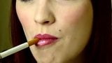 attractive woman smoking a cigarette up close snapshot 1