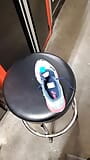 at the auto shop playing with Asics tennis shoes I found in customer SUV snapshot 1