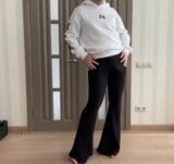 Sissy in flared boot cut black trousers and white hoodie with roses masturbating and dancing for your pleasure snapshot 2