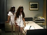 Hot Latina lesbian nurses lick each other sensually at the hospital snapshot 2