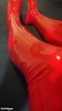 Shiny red latex rubber stockings closeup snapshot 2