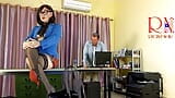 A giant secretary sits on an office desk. The manager guy is very surprised at her height. snapshot 2