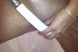 A Pakistani chick playing with a shower head on her pussy snapshot 2