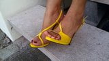 6 Putting on yellow strappy high heel sandals & zooming in. snapshot 6