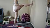 Doing yoga in panties doing a wall stretch for hamstrings snapshot 15