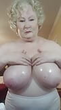 Naughty Granny Oils Up Her Massive Tits, Do You Like? snapshot 1