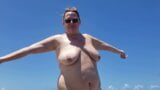 BBW standing on nude beach getting some sun looking at her big tits – twinkie Chubby mature Milf snapshot 4