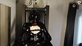 Rubberslut with Heavy Rubber Helmet fucking her pussy on slave chair snapshot 6