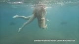 Julia and Masha are swimming nude in the sea snapshot 13