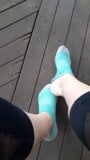 Taking off my socks outside and rubbing my feet together snapshot 1