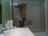Girl in glass taking a shower snapshot 4