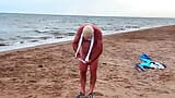 My husband in a chastity cage is exposed on a beach snapshot 11