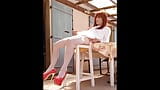 Sexy Rehead Crossdresser Shemale High Heels Stockings Masturbation on chair in garden snapshot 1