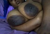 Monster black tits with huge areola on laid out BBW snapshot 2