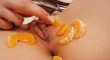 She licks her fruit covered pussy and puts a banana inside snapshot 3