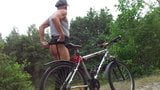 MAGGIE-ER-BIJ buttnaked & tattood ass on bicycle in a forest snapshot 3