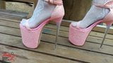 Lady L walking in towering pink extreme high heels. snapshot 2