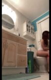 Teen girl sitting on toilet  snapshot 2