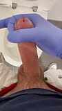 Jerking doctor at a toilet with latex gloves snapshot 5