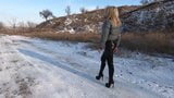 Blonde MILF walking in shiny leggings and puffer jacket snapshot 2