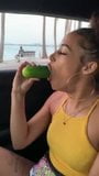 A women eating a cucumber snapshot 1