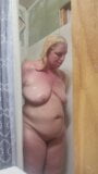 Blonde taking hot shower snapshot 5