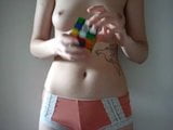 Topless Amateur solves rubiks cube in just over 1 minute snapshot 2