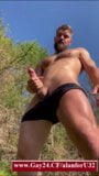 Muscular gay man jerks off a big dick outside the house snapshot 1