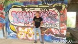 Young guy masturbates in public in front of graffiti wall snapshot 1