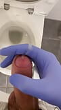 Jerking doctor at a toilet with latex gloves snapshot 10