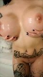 Tatted Bimbo Shows off Tits snapshot 4