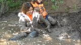 Three Girls in Mud in Winter Clothes snapshot 8