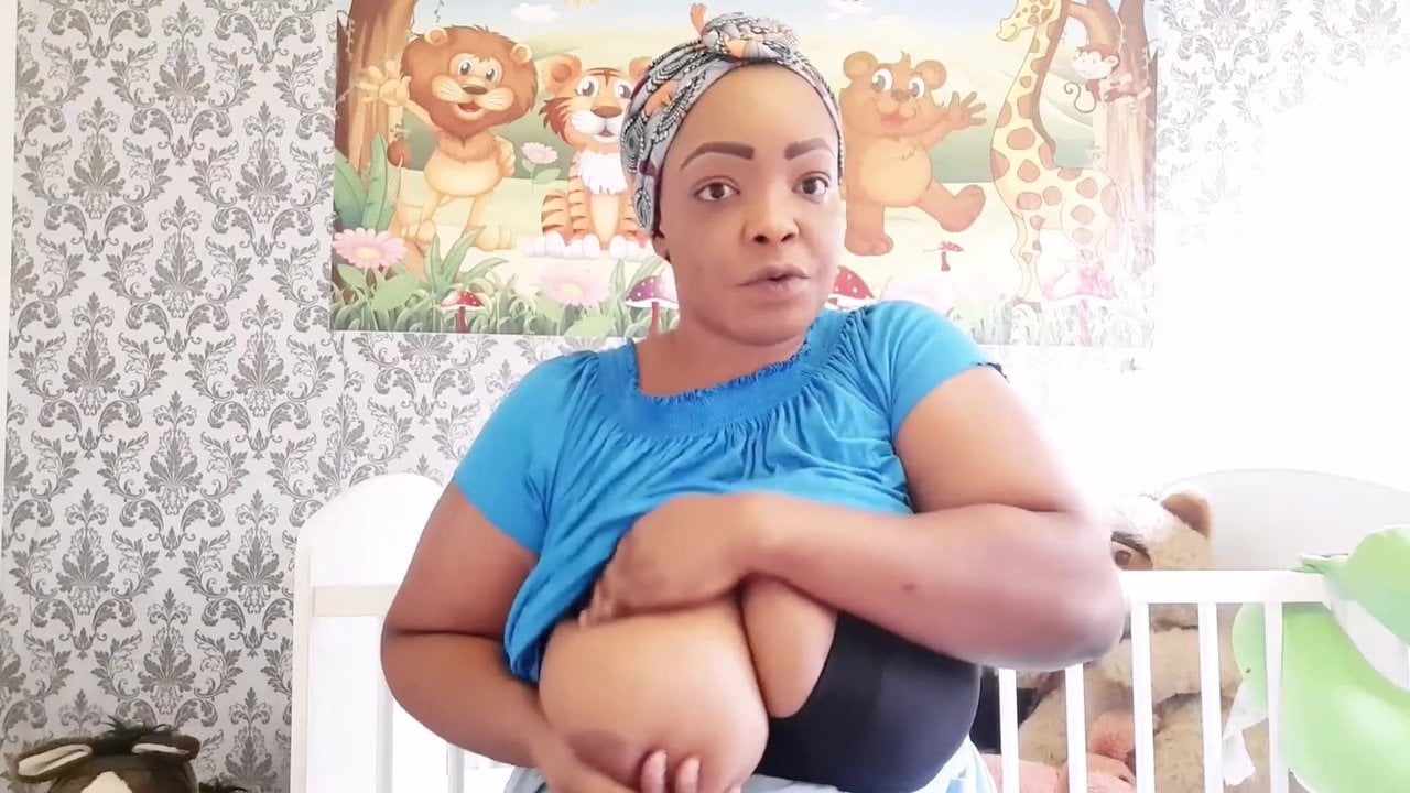 Nigerian step mom shows how to massage and milk her huge udders