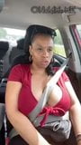 Solo ebony Desiree Desire flashes her tits while driving snapshot 1