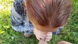 Une MILF rousse suce son jeune ami dans un parc public snapshot 11