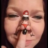 Dancing Santa on girl's nose snapshot 1