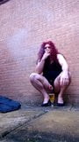 Transvestite drinking piss and smoking outdoors. snapshot 7