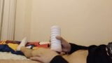 The young man tries the new toy in the bed by massaging it by hand and records it as a video. snapshot 7