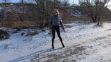 Blonde MILF walking in shiny leggings and puffer jacket snapshot 1