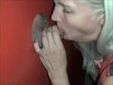 Platinum blonde milf works the cock in the gloryhole booth snapshot 3