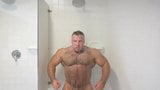 bodybuilder andre mark flexing in shower snapshot 2