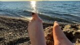 Mistress Lara plays with her feet and toes on the beach snapshot 2