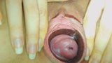 Woman showing her gaping pussy and cervix snapshot 3